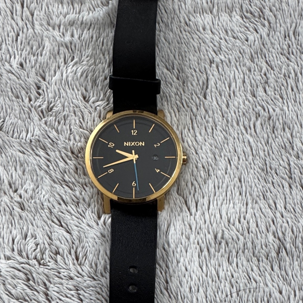 Nixon Gold-Trimmed Black Watch, The Rollo